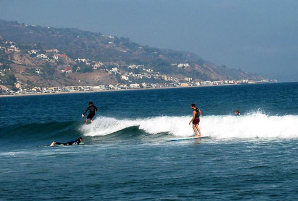 Surfing in Malibu Lagoon State Beach in Malibu, California